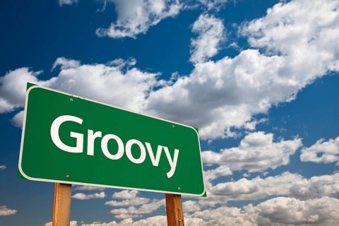 Groovy green road sign with dramatic clouds and sky