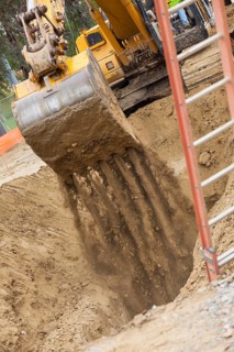 Working excavator tractor digging A trench