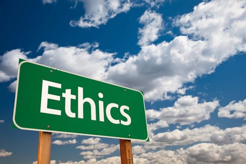 Ethics green road sign with copy room over the dramatic clouds and sky