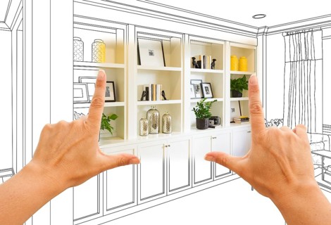 Hands framing custom built-in shelves and cabinets design drawing with section of finished photo