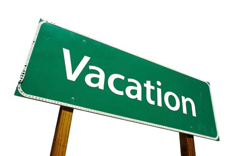 Vacation green road sign isolated on a white background with clipping path