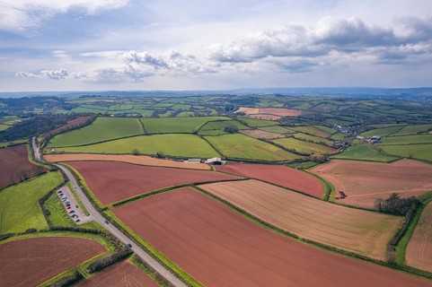 Devon Fields and Farmlands at sunset time from a drone over Shaldon and Teignmouth from Labrador Bay
