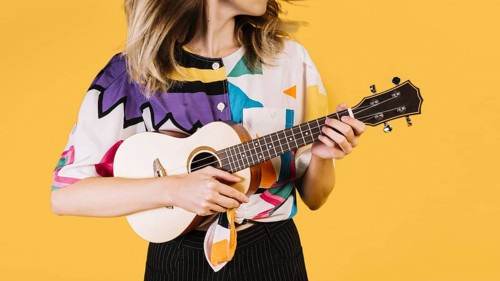 girl playing ukelele