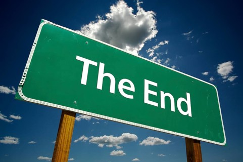 The end road sign with dramatic blue sky and clouds