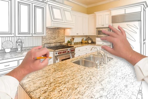 Male hands sketching with pencil A custom kitchen with photo showing through
