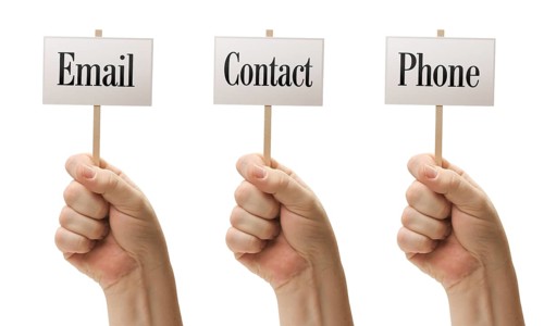 Three signs in male fists saying email