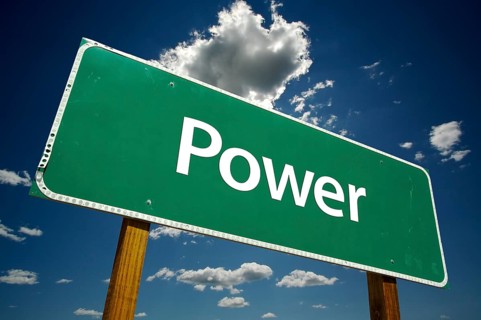 Power road sign with dramatic clouds and sky
