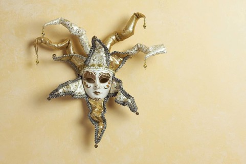 Beautiful venetian mask on light yellow wall