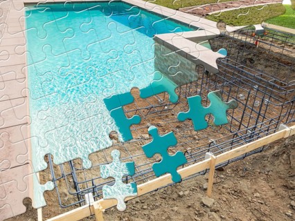 Puzzle pieces fitting together revealing finished pool build over construction