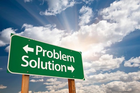 Problem and solution green road sign with dramatic clouds and sky