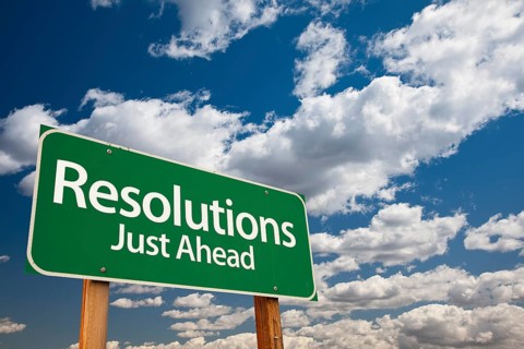 Resolutions green road sign over dramatic clouds and sky