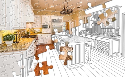 Puzzle pieces fitting together revealing finished kitchen build over drawing