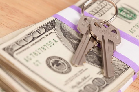 House keys on stack of money