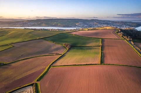Devon Fields and Farmlands at sunset time from a drone over Shaldon and Teignmouth from Labrador Bay