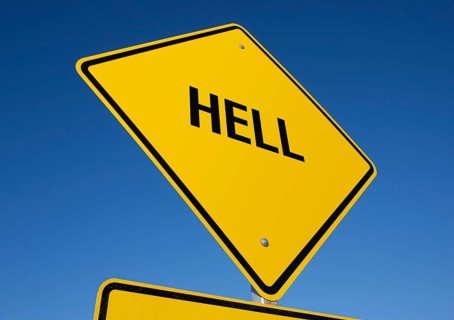 Hell yellow road sign against a deep blue sky with clipping path