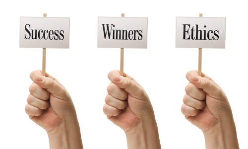 Three signs in male fists saying success