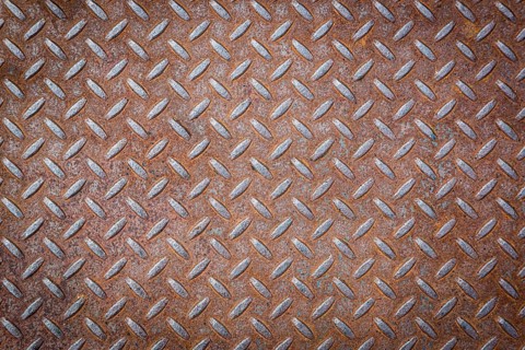 Rusty vignetted metal texture background