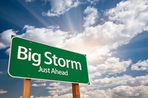 Big storm green road sign with dramatic clouds and sky