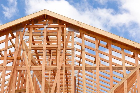 Abstract of wood home framing at construction site