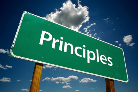 Principles road sign with dramatic clouds and sky