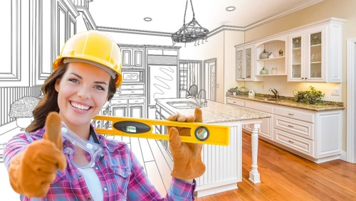 Female construction worker in front of custom kitchen drawing gradating to finished kitchen photo