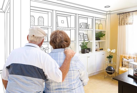 Senior couple facing custom built-in shelves and cabinets design drawing gradating to finished photo