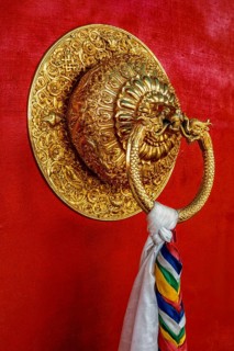 Lion shaped door handle in Buddhist temple. Kaza