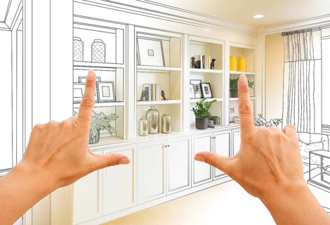 Hands framing custom built-in shelves and cabinets design drawing with section of finished photo