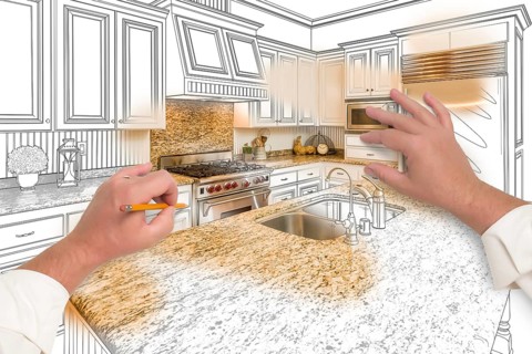 Male hands sketching with pencil A custom kitchen with photo showing through