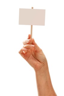 Woman holding blank white sign isolated on a white background