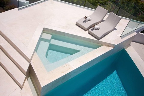 Custom luxury pool and chairs abstract with two jrts relaxing