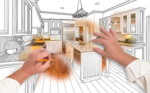Male hands sketching with pencil A custom kitchen with photo showing through