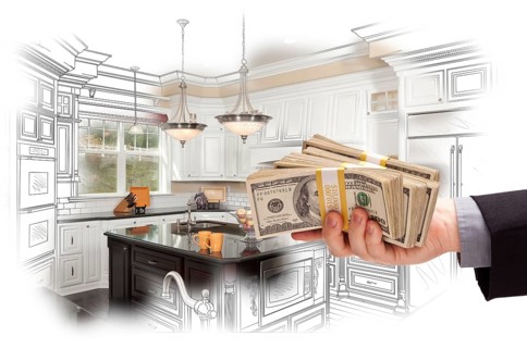 Hand holding stacks of money over custom kitchen design drawing and photo combination