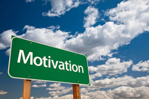 Motivation green road sign with copy room over the dramatic clouds and sky
