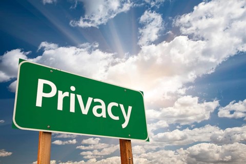 Privacy green road sign with dramatic clouds