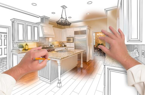 Male hands sketching with pencil A custom kitchen with photo showing through