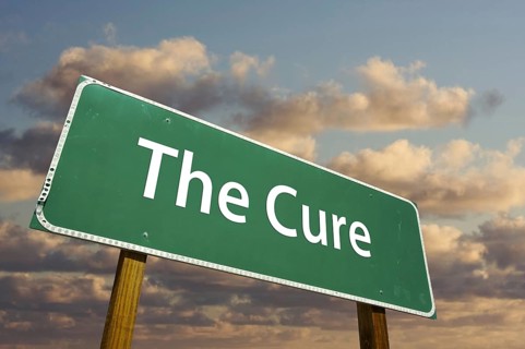 The cure green road sign with dramatic clouds and sky