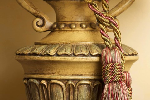 Lamp on table with ornate hanging tassel