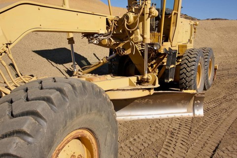 Tractor at a construction site and dirt lot