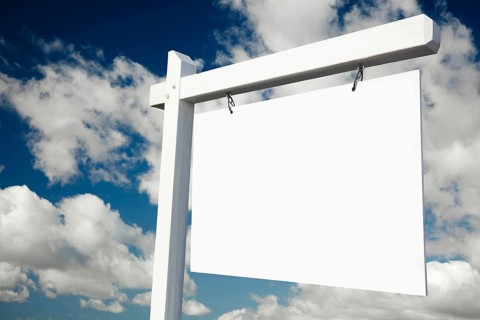 Blank real estate sign on clouds & sky background