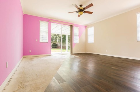 Empty room with cross section showing before and after with new wood floor and paint
