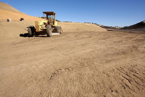 Tractor at a construction site and dirt lot