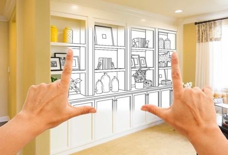 Hands framing custom built-in shelves and cabinets design drawing with section of finished photo
