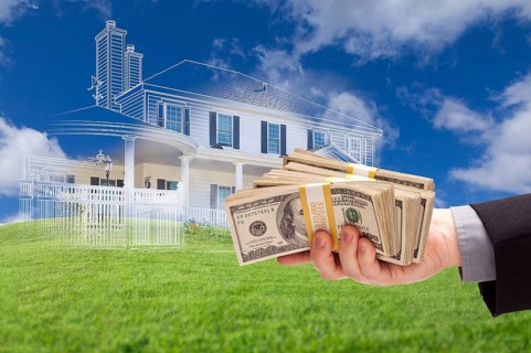 Male handing over thousands of dollars with ghosted house drawing