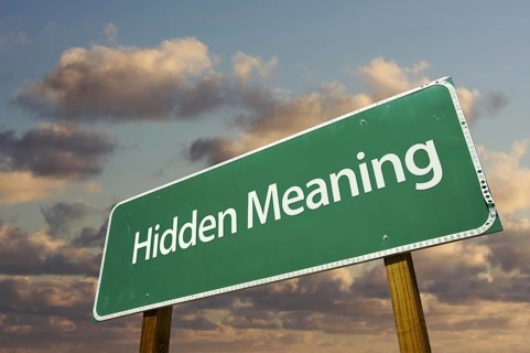 Hidden meaning green road sign with dramatic clouds and sky