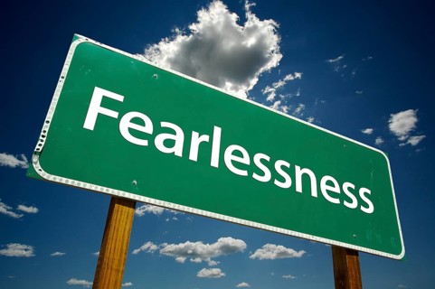 Fearlessness road sign with dramatic blue sky and clouds