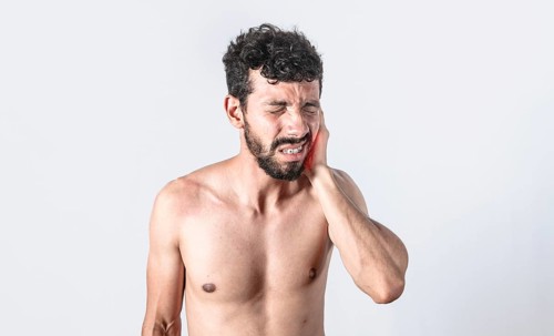 Person with earache on isolated background