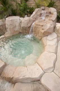 Tropical custom pool with waterfalls