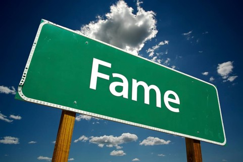 Fame road sign with dramatic clouds and sky