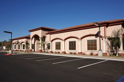 New vacant retail building and empty parking lot